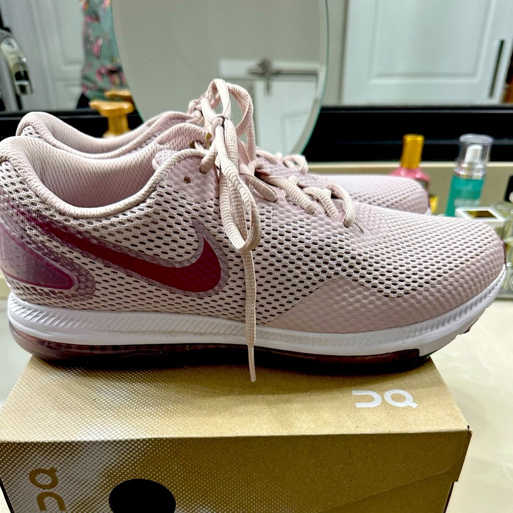 Women’s pink Nike running shoes. Size 10